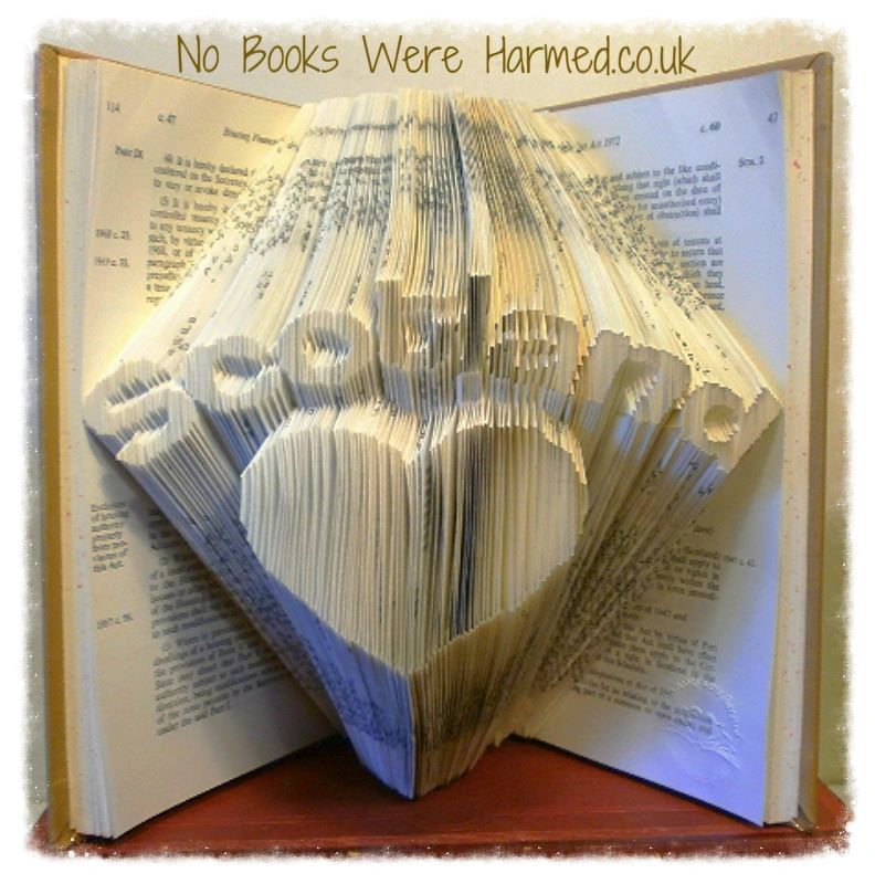 Hand-folded book art featuring the word 'Scotland' over a love heart, crafted from vintage book pages.